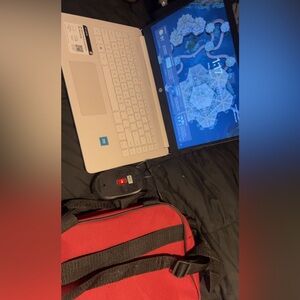 HP Silver Laptop with Black and Red Accessories